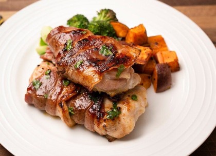 Glazed Bacon Wrapped Thighs With Roasted Vegetables