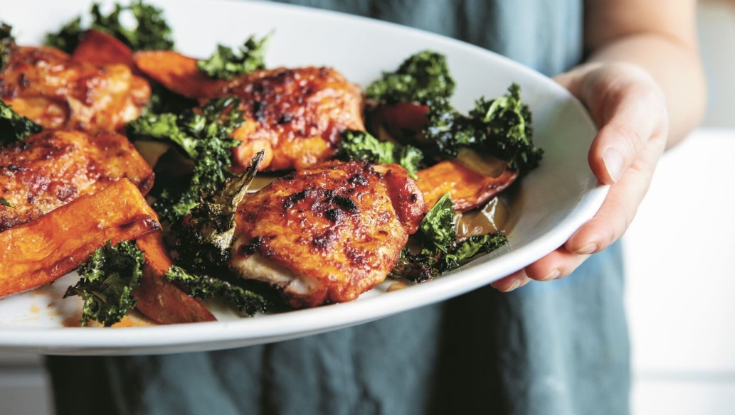 Paprika Chicken With Sweet Potatoes And A Crispy Kale Crown in the plate