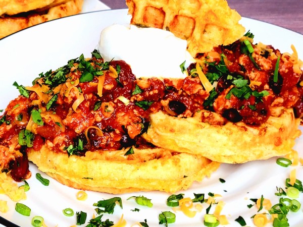 Chicken Chili Over Cheddar Cornbread Waffles