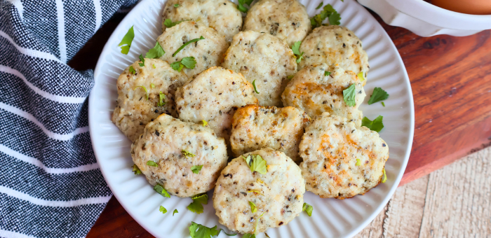 Homemade air fryer chicken breakfast sausage patties made with Springer Mountain Farms ground chicken, served on a white plate with fresh herbs — easy make-ahead breakfast recipe.