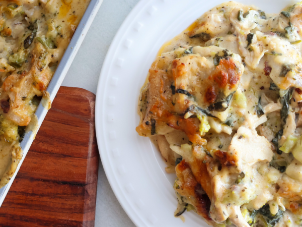 Creamy chicken and broccoli sheet pan lasagna served on a white plate – easy weeknight baked chicken pasta dinner