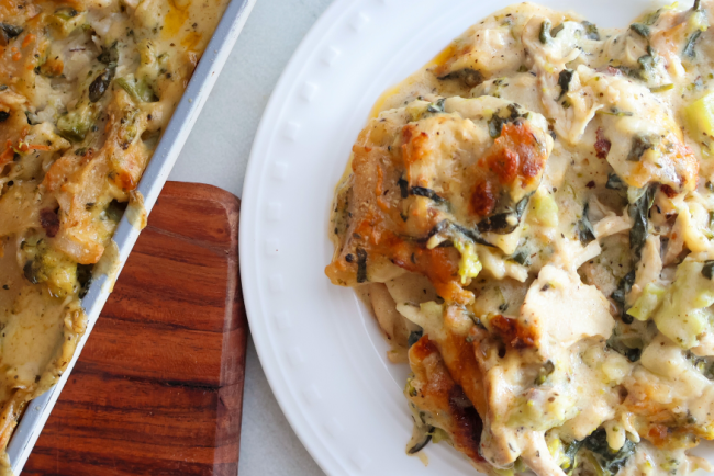 Creamy chicken and broccoli sheet pan lasagna served on a white plate – easy weeknight baked chicken pasta dinner