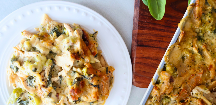 Creamy chicken and broccoli sheet pan lasagna served on a white plate – easy weeknight baked chicken pasta dinner