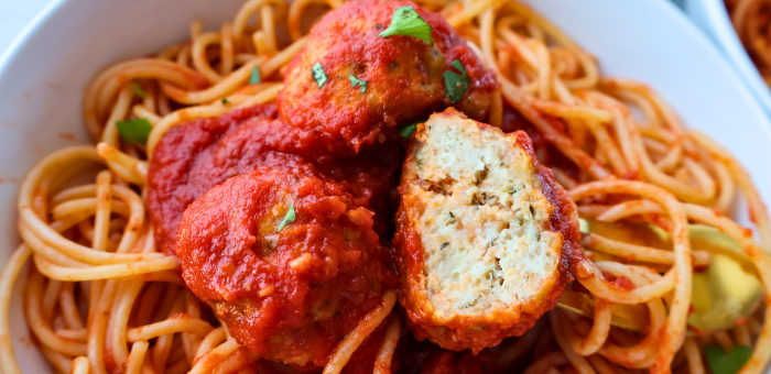Italian chicken meatballs in marinara sauce served over spaghetti pasta.