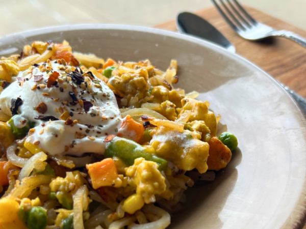 Loaded ground chicken hashbrowns with mixed vegetables, melted cheese, and a dollop of sour cream.