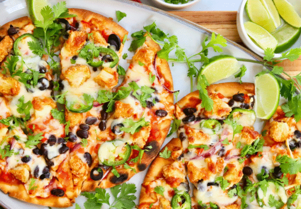 Easy Santa Fe chicken flatbread pizza recipe topped with black beans, jalapeños, melted cheese, and fresh cilantro — a quick and flavorful weeknight dinner.