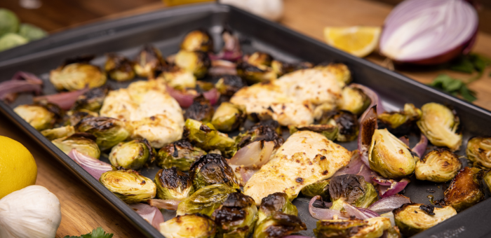 Sheet pan honey mustard chicken with roasted brussel sprouts and onions.