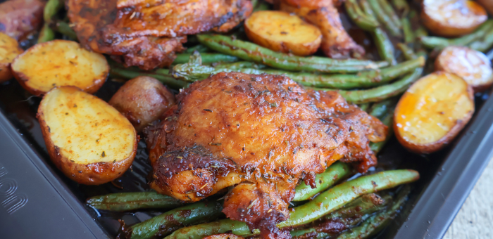 Oven-roasted bone-in chicken thighs with potatoes and green beans on a sheet pan – one-pan chicken dinner with vegetables