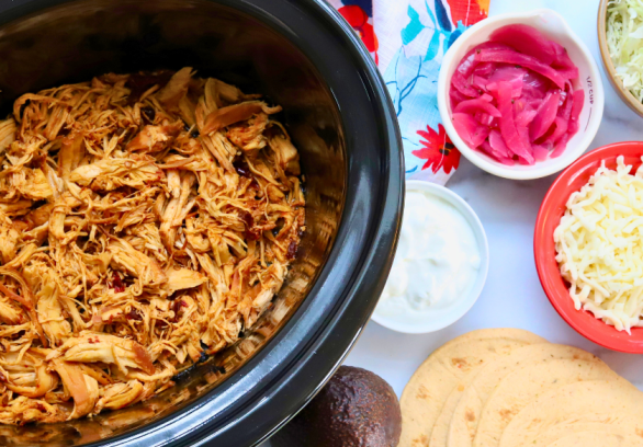 Slow cooker honey chipotle shredded chicken with taco toppings and corn tortillas – spicy chicken meal prep tacos