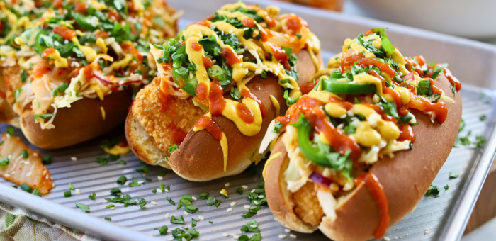 Crispy chicken Korean bird dogs made with fully cooked gluten free breaded chicken chunks in toasted buns with spicy toppings