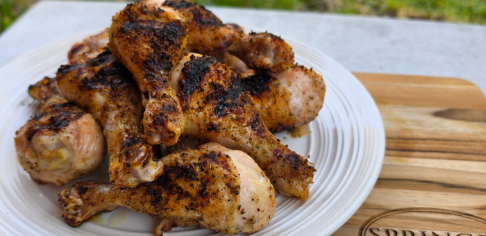 grilled chicken drumsticks with crispy skin served on a plate