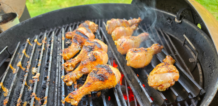 chicken drumsticks finishing over direct heat to crisp the skin