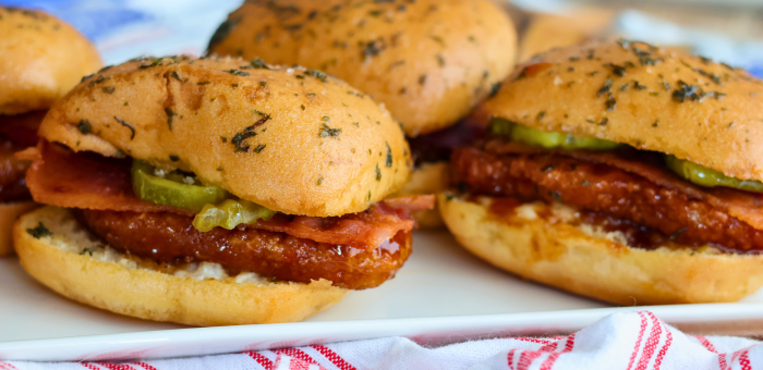 Hot honey chicken sliders made with fully cooked gluten free breaded chicken fritter strips on toasted slider buns