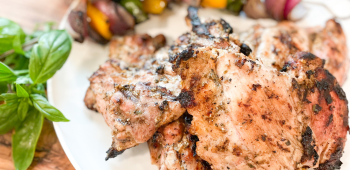 yogurt marinated grilled chicken served with grilled vegetables and fresh basil